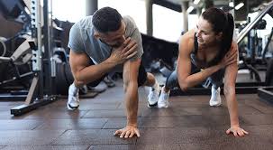 Toning Bingo Wings: Your Ultimate Guide to Sculpting Sleek Arms at the Gym 3 Fitness trainer demonstrating arm toning exercises Earl Shilton